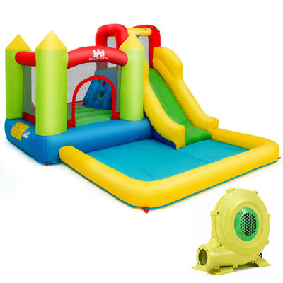 Colorful inflatable bounce house with slide, attached pool, safety netting, and air blower